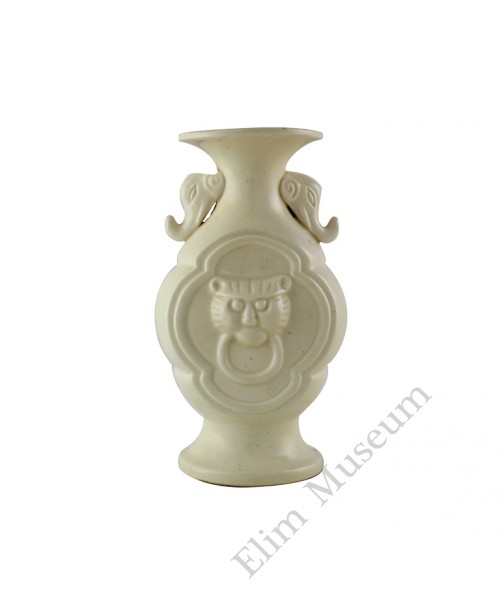 1132   A Ding-Ware  vase with mold tiger heads.  