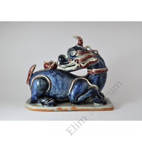 1658 An under glaze B&R statue of Chinese ancient "legal beast" with lotus 