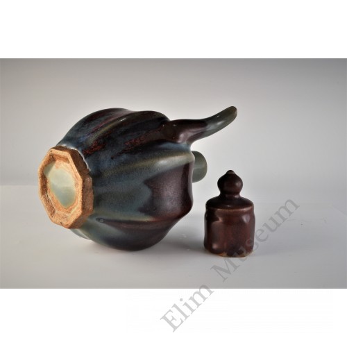 1711 A stoneware lidded ewer in lavenda blue glaze and purple splashes    
