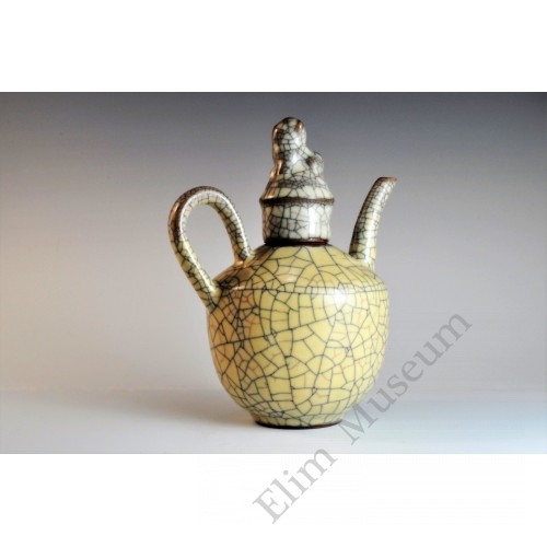 1722 A stoneware ewer with ivory crackle glaze    