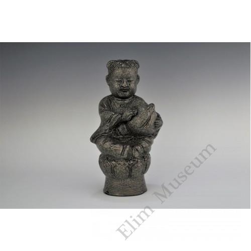 1724  A Yue-ware hand-scupted "peach boy"  seated on lotus