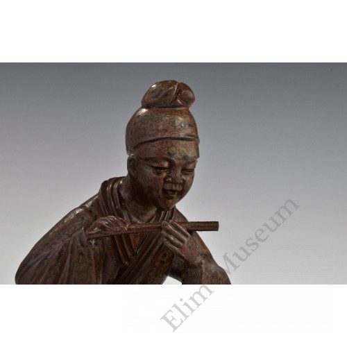 1725 A greem glazed sculpted earthenware musician 