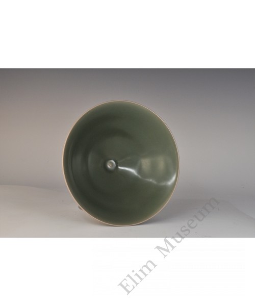 1735 An iridescent green glaze conical bowl 