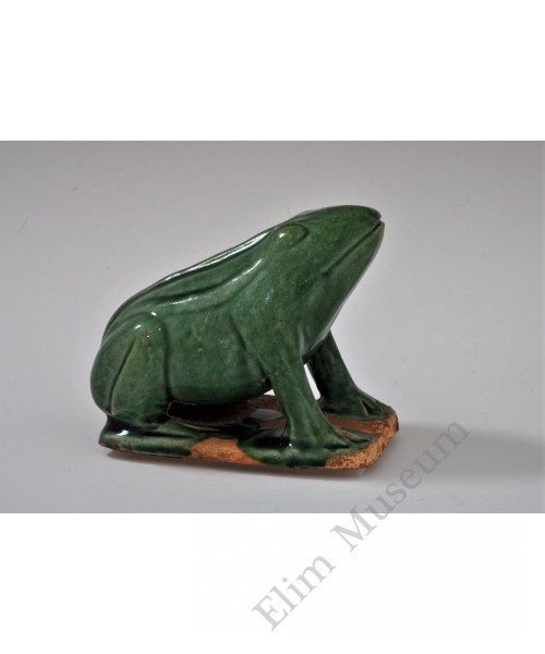 1745 A molded and sculpted green glaze frog   
