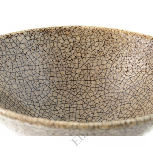 1239 A bowl with straw-yellow glaze and "roe pattern"